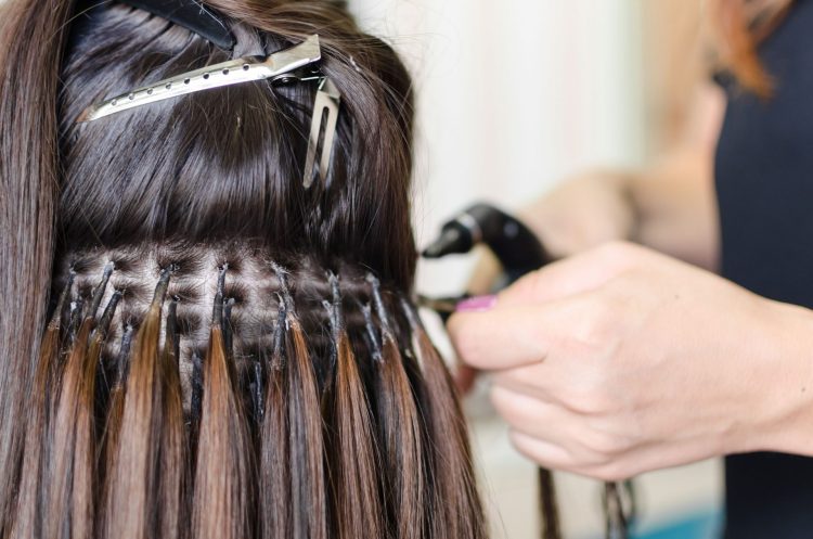 Unleashing the Power of Transformation: Why Visit a Hair Extensions Salon